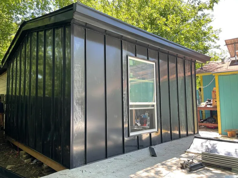 Black standing seam metal wall panels for Metal Roof Installation in New Brunswick